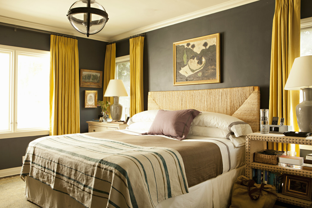 casual bedroom with dark furniture and cream fabrics