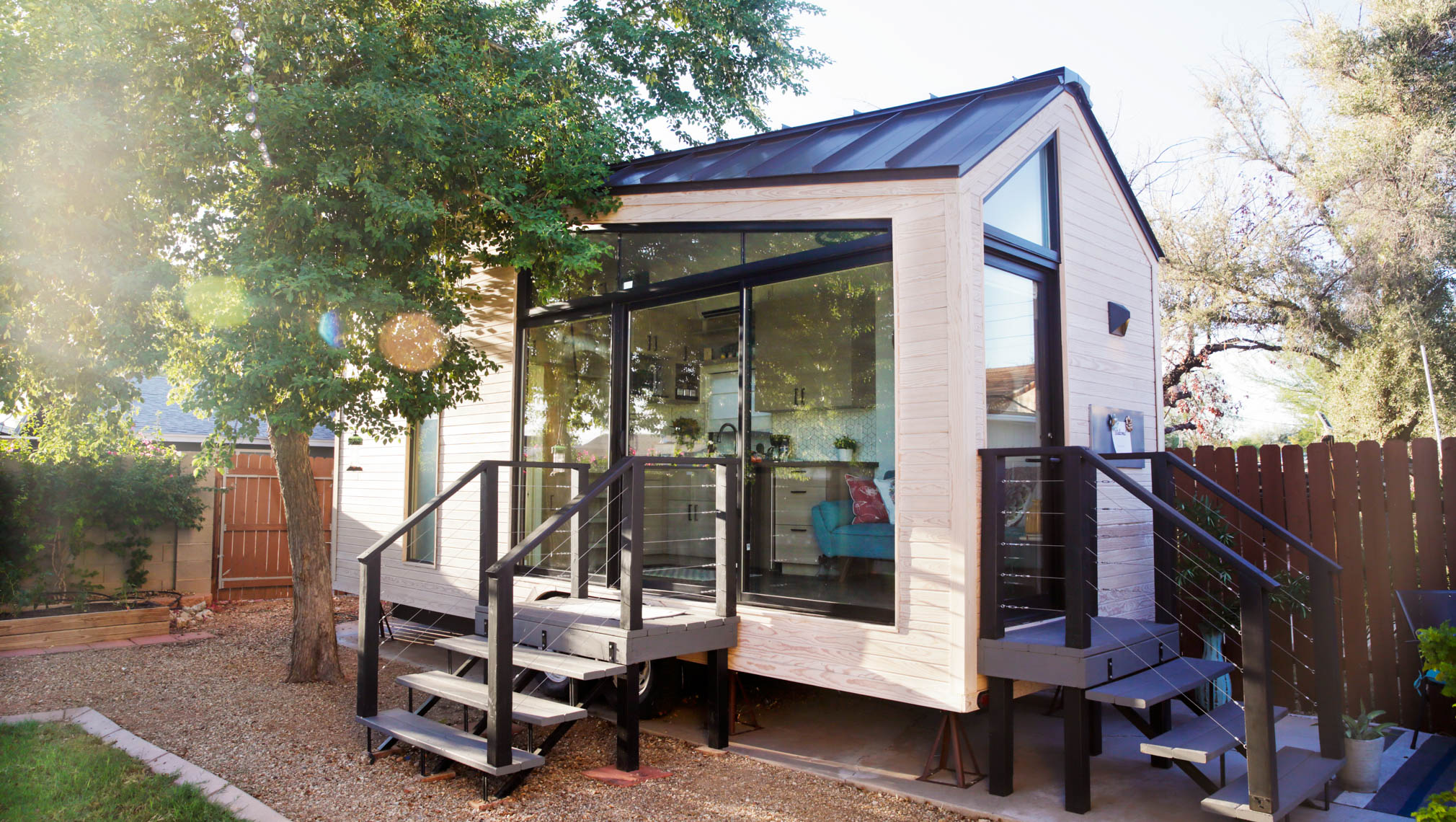 A white accessory dwelling unit with two staircases