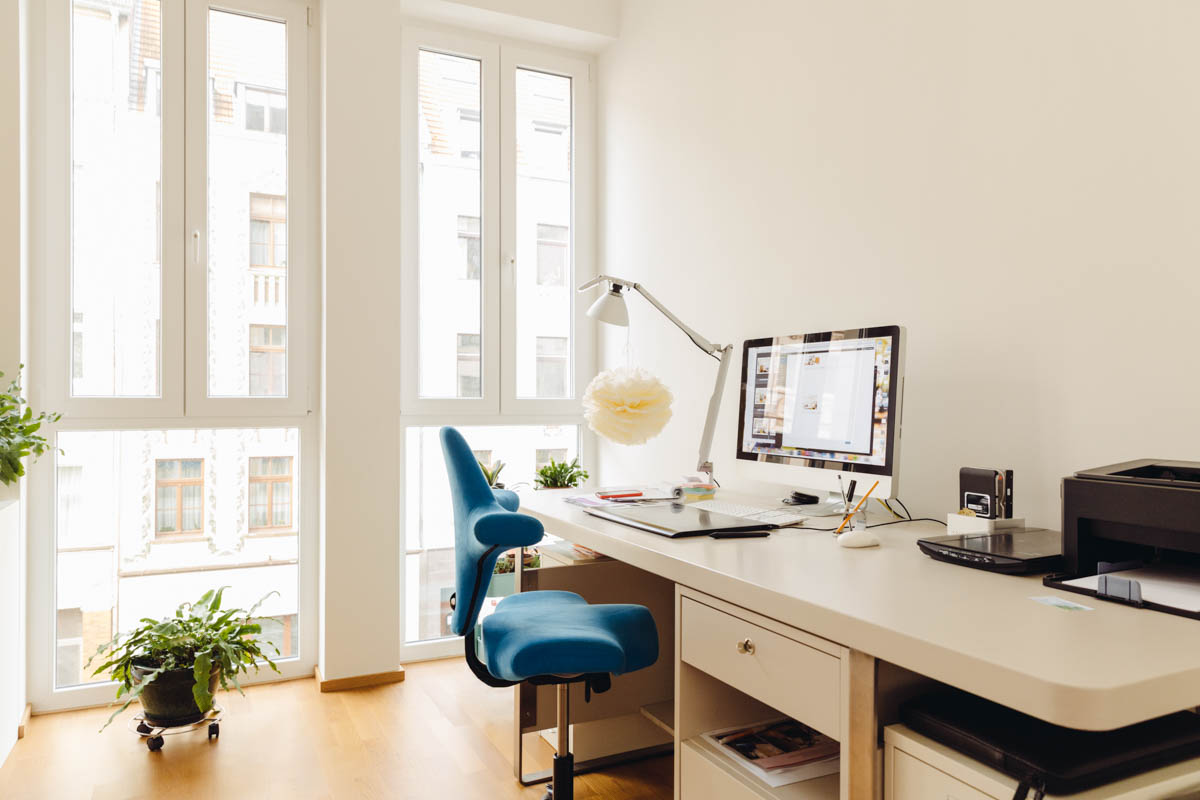 Image of home office with computer desk in modern building