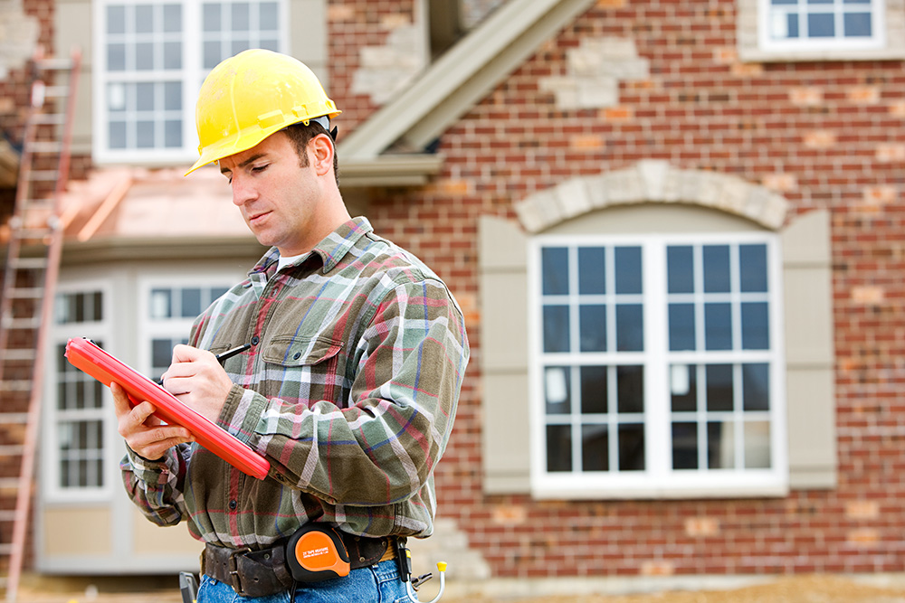 A home inspector reviewing home for a inspection contingency