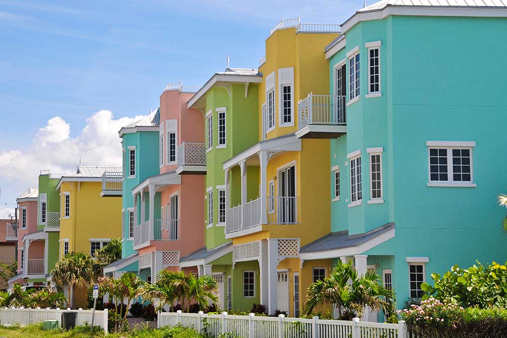 Row houses in bright easter egg colors.