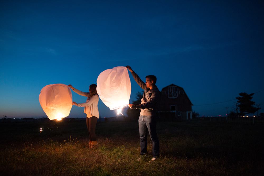 couple sending off lanterns