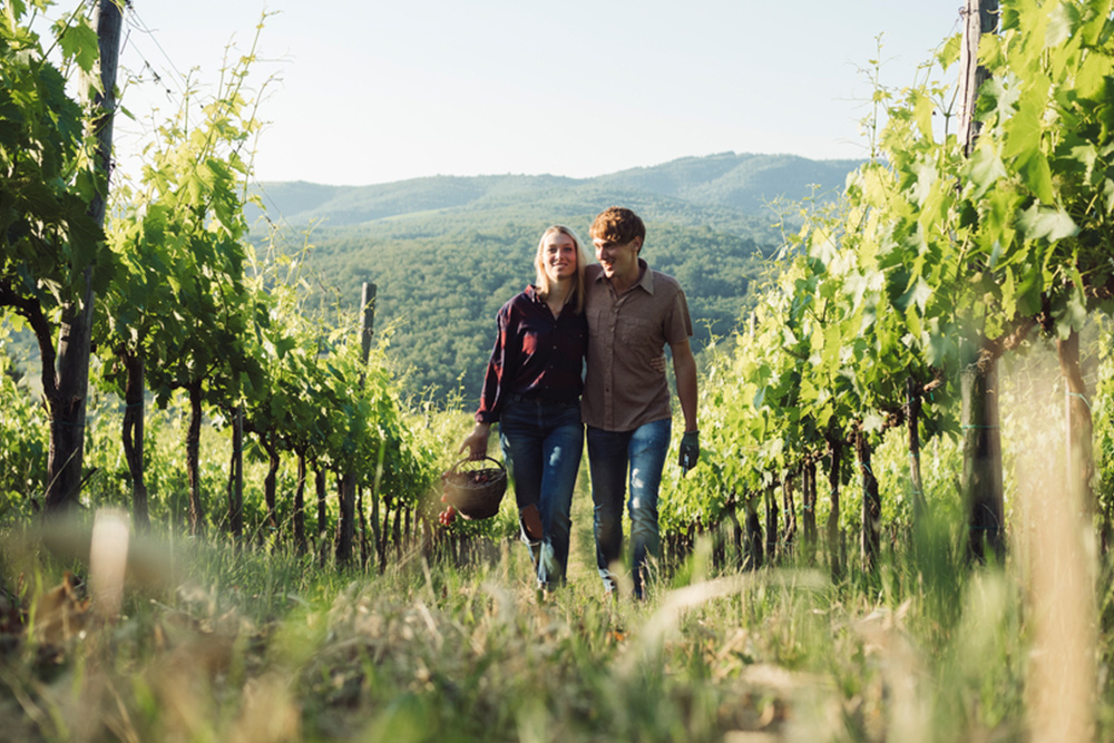 Couple walking in vineyard bought with va loans