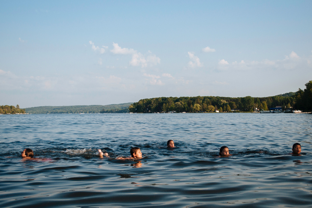 kids swimming in lake