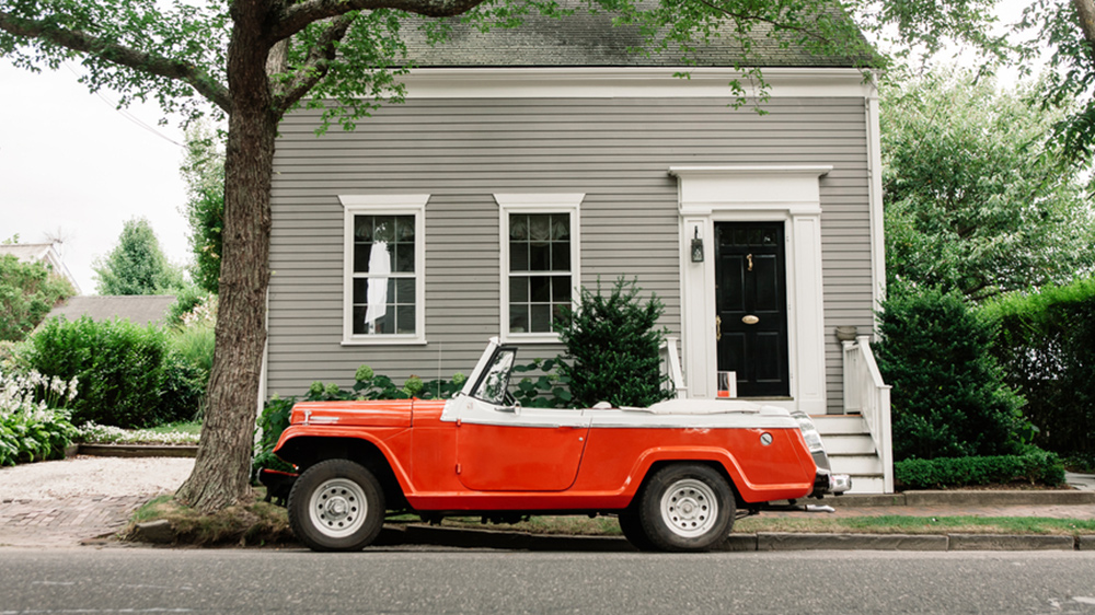 red car in front of house owners have anxiety over buying a house