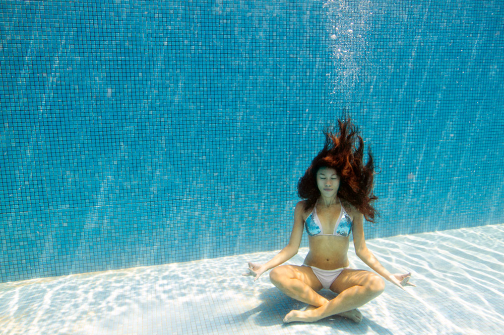 girl meditating under water