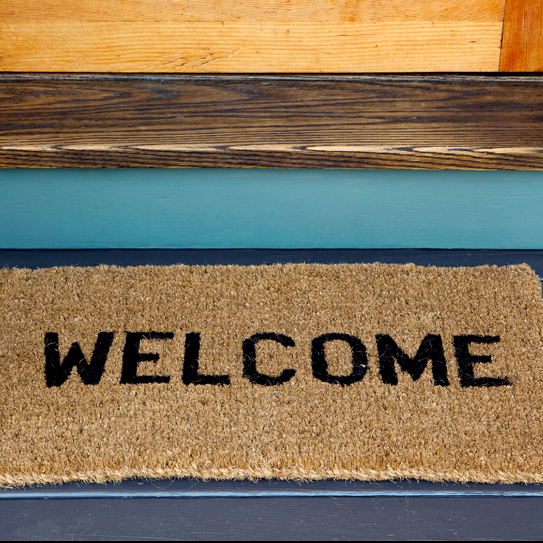 welcome mat in front of door