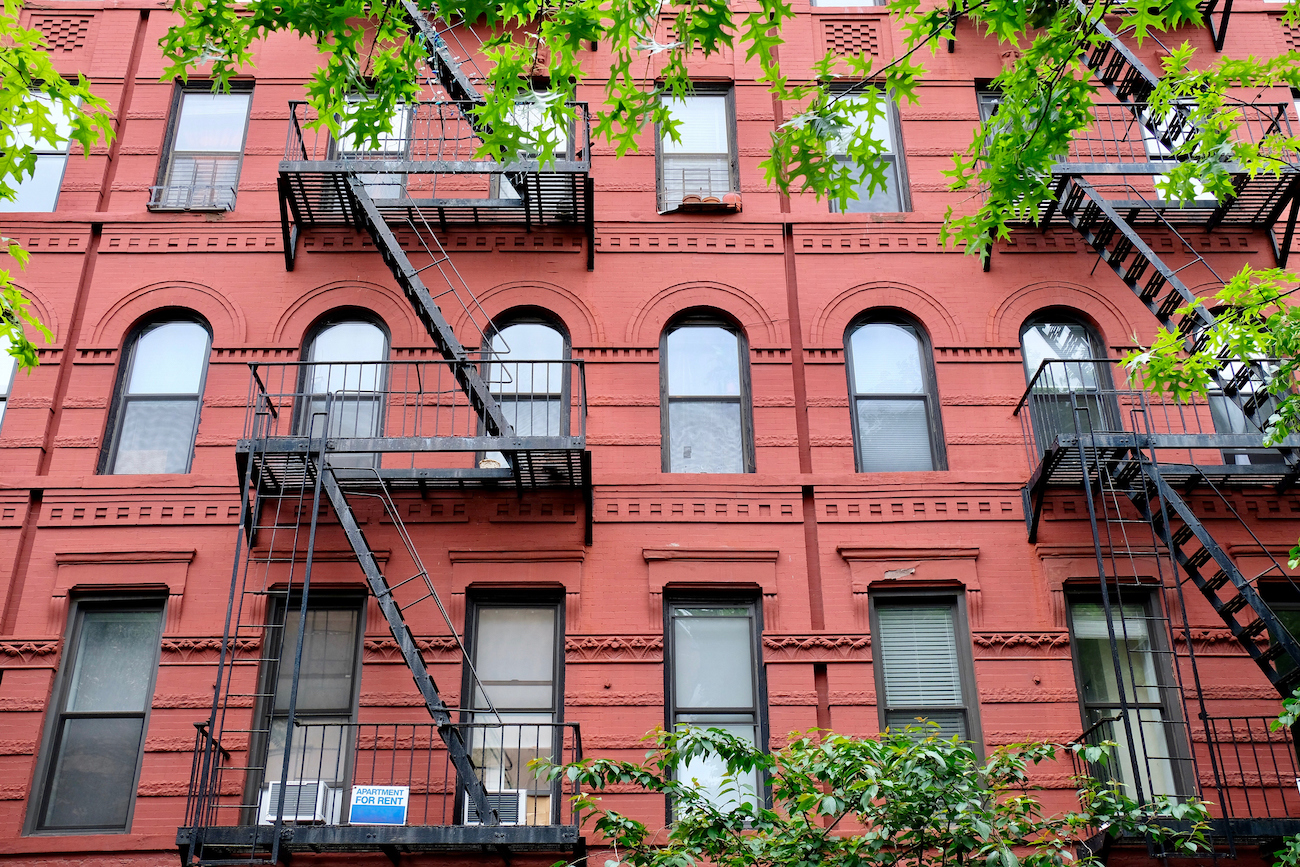 fair housing act nyc - apartment facades with fire escapes
