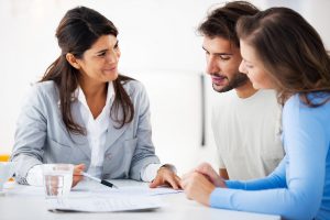 Couple with lender closing on their new home
