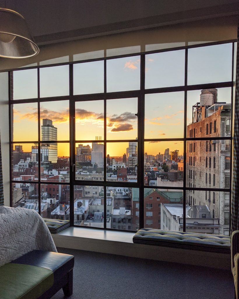 carissa burton - sunset over NYC through big casement window