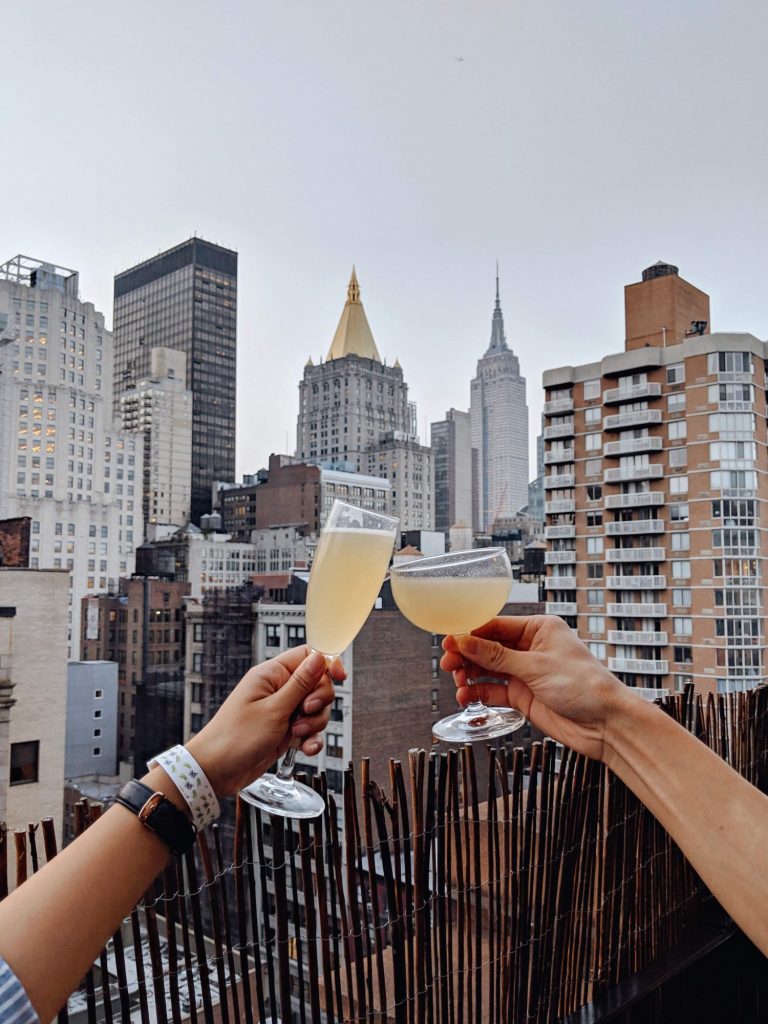 Kelly Liang - champagne toast over nyc skyline