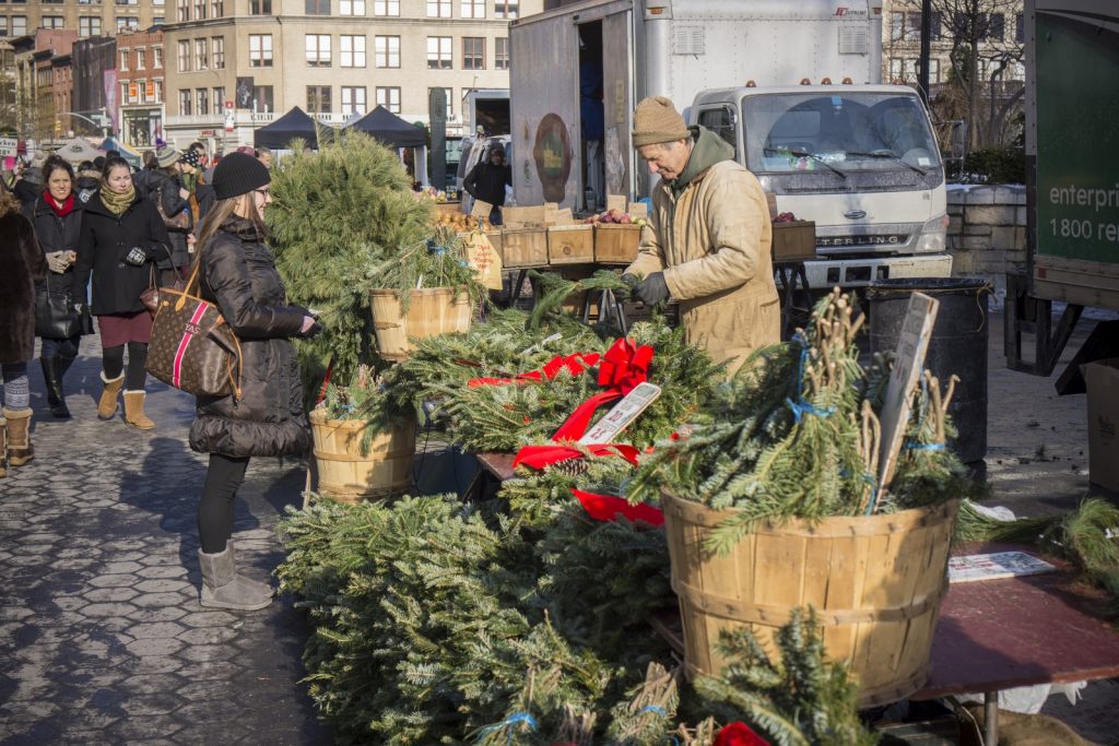 NYC street vendor sells wreaths for Christmas