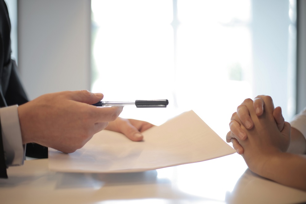 Two people negotiating a contract