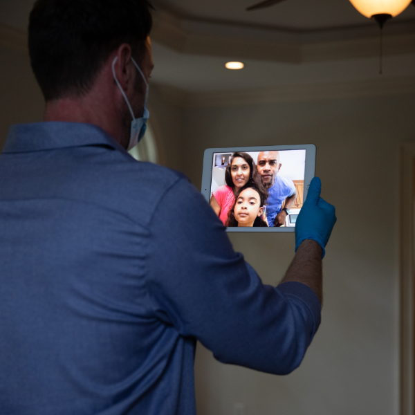 man videochatting with family